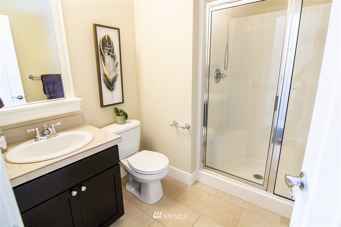 3924 185th Place Southeast Bothell, WA 98012 - Photo 12 of 25 a bathroom with a sink and a mirror