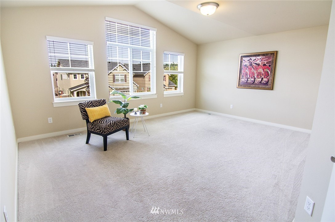 3924 185th Place Southeast Bothell, WA 98012 - Photo 14 of 25 a view of a livingroom with wooden furniture and a window