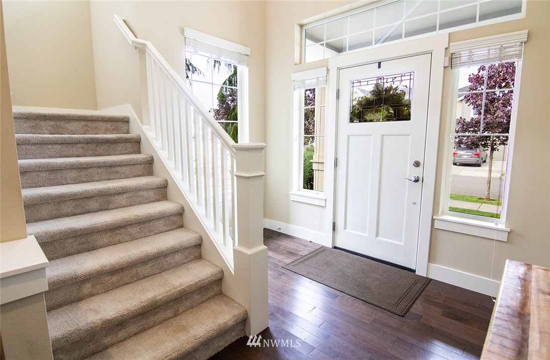 3924 185th Place Southeast Bothell, WA 98012 - Photo 4 of 25 a view of entryway with wooden floor and front door