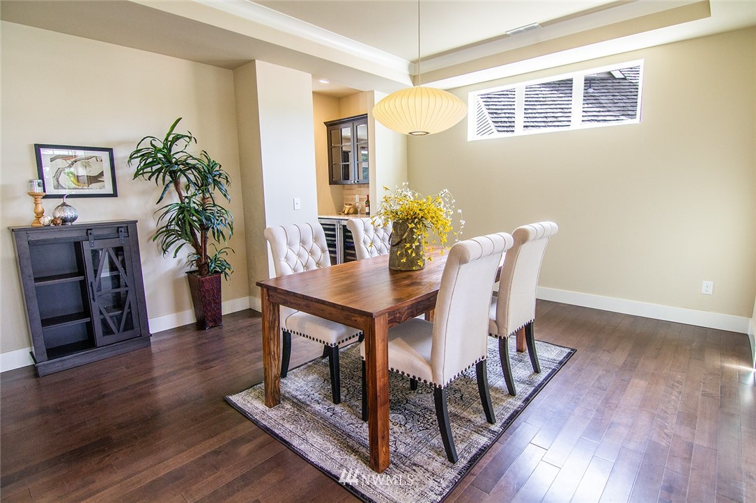3924 185th Place Southeast Bothell, WA 98012 - Photo 5 of 25 a view of a dining room with furniture and wooden floor