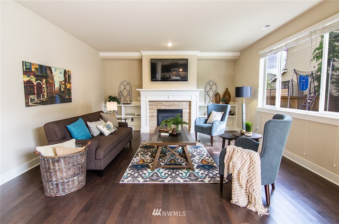 3924 185th Place Southeast Bothell, WA 98012 - Photo 9 of 25 a living room with furniture fireplace and window