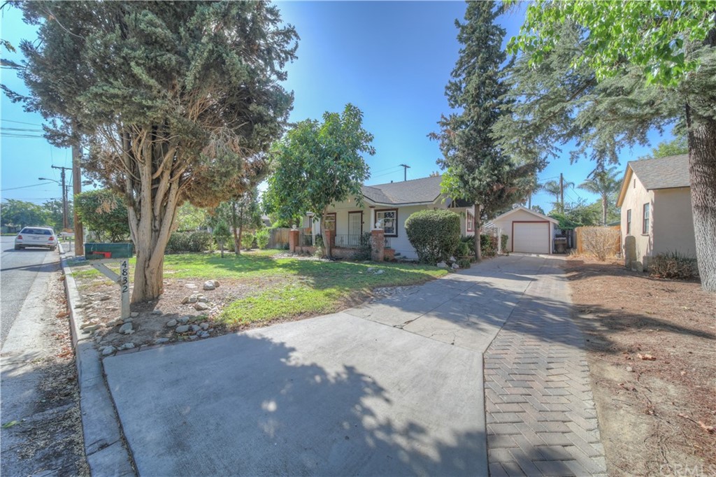 4832 Charlotte Way Riverside, CA 92504 - Photo 1 of 1 a view of a yard with plants and a trees