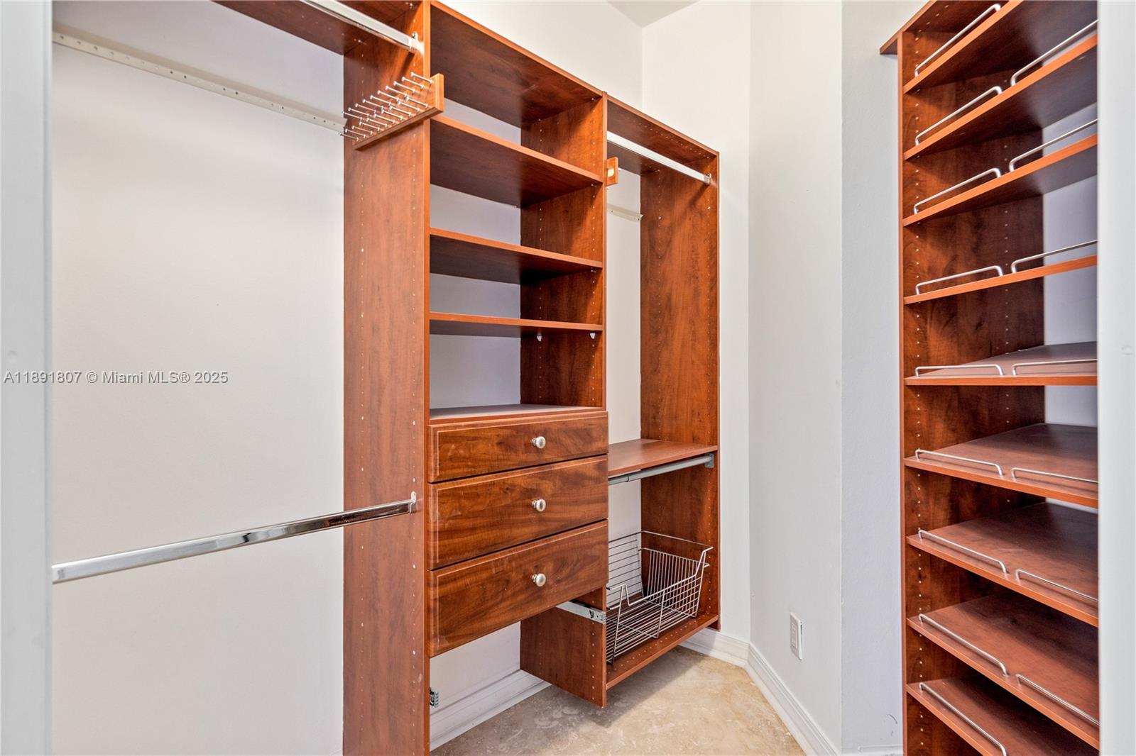 701 Brickell Key Boulevard, Unit 1411 Miami, FL 33131 - Photo 14 of 20 a view of walk in closet with empty racks
