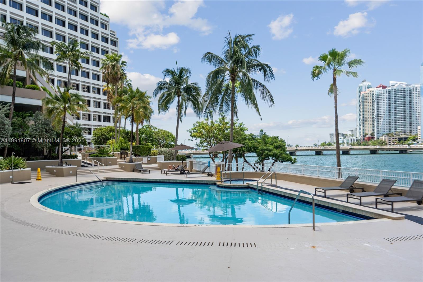 701 Brickell Key Boulevard, Unit 1411 Miami, FL 33131 - Photo 15 of 20 a view of swimming pool with outdoor seating