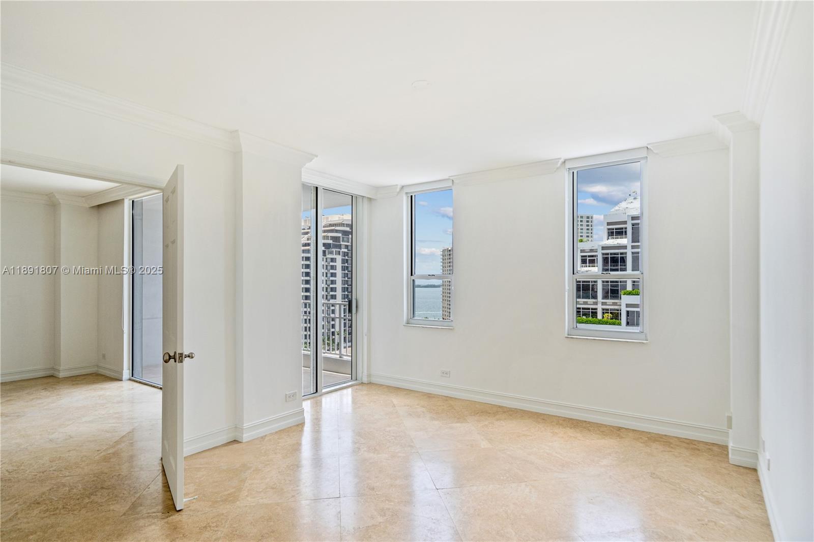 701 Brickell Key Boulevard, Unit 1411 Miami, FL 33131 - Photo 10 of 20 an empty room with windows