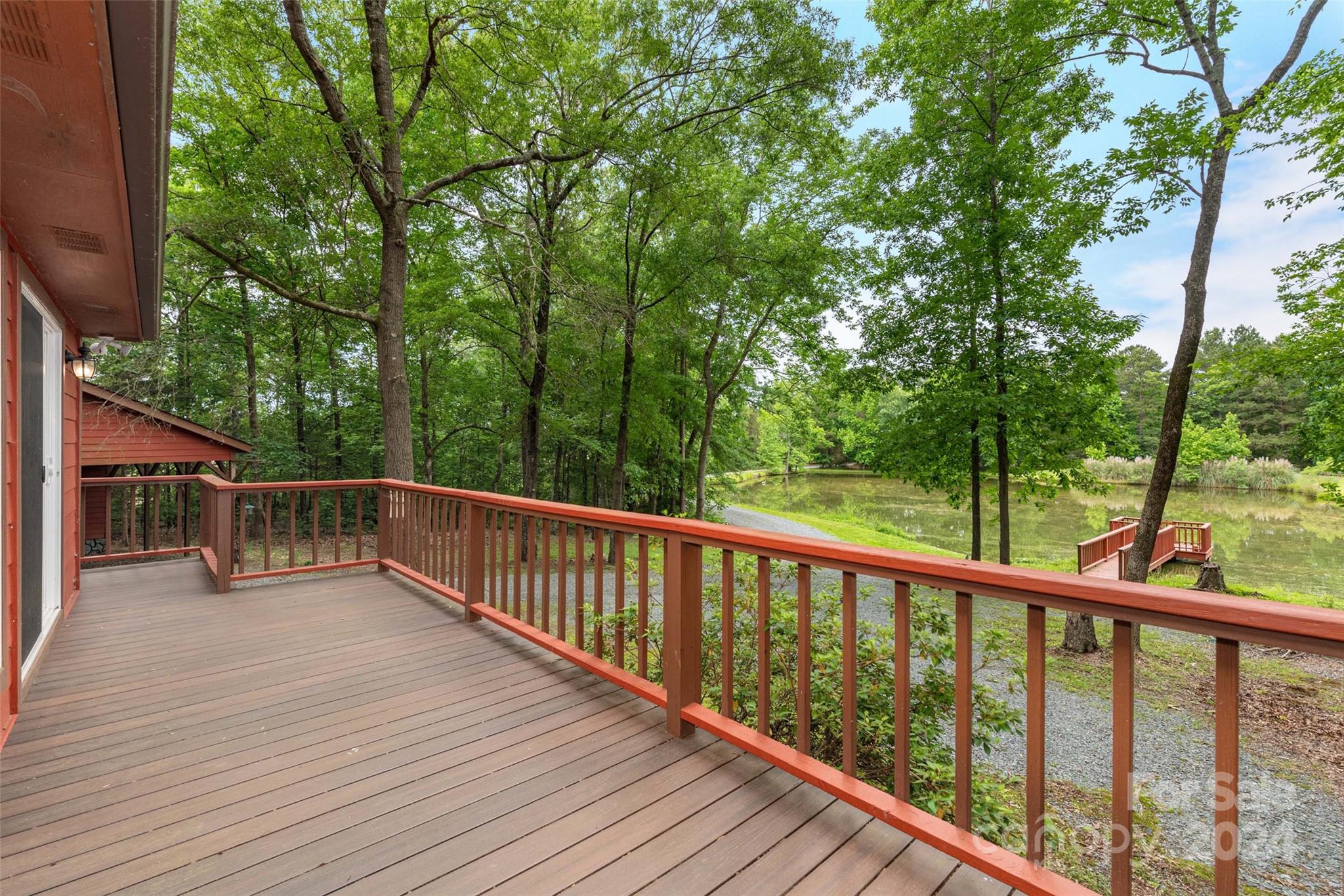 7020 Shelf Road Marshville, NC 28103 - Photo 29 of 45 a balcony with wooden floor and trees