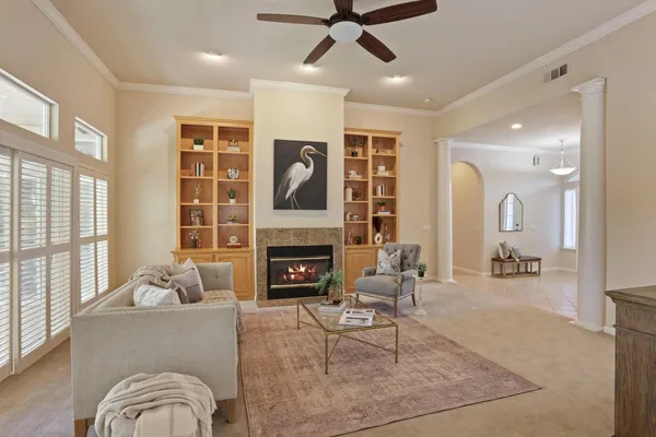 a living room with furniture and fireplace