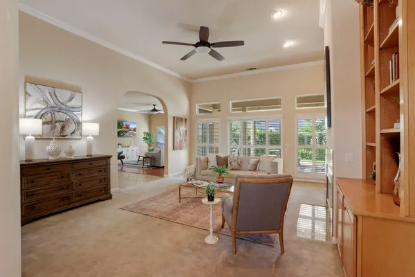 a living room with furniture and windows