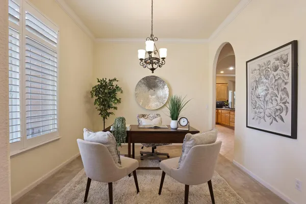 a dining room with furniture and window