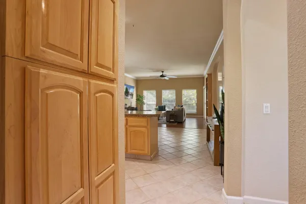 a view of a hallway with living room