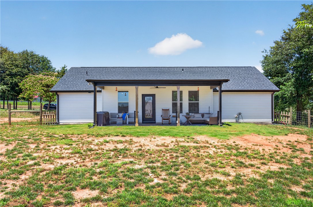 106 Bolt Road Townville, SC 29689 - Photo 27 of 33 A spacious covered patio offers ample outdoor living space overlooking a generous, verdant yard.