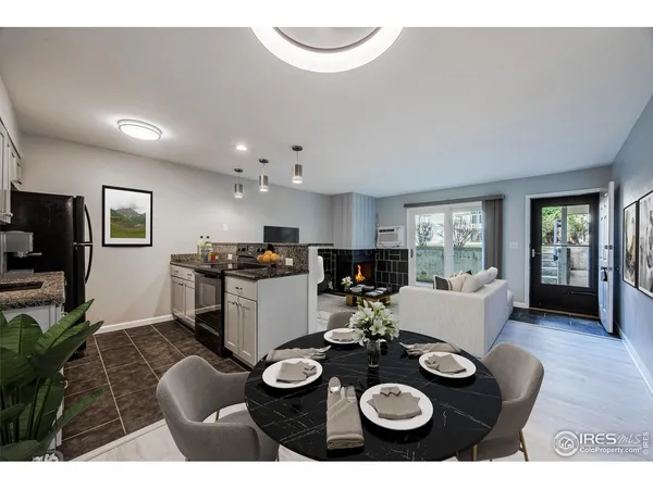 a kitchen with a table and chairs in it