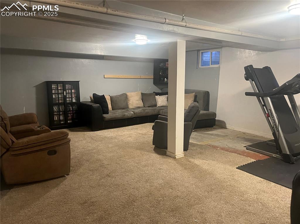 66 Louis Nelson Road Pueblo, CO 81001 - Photo 22 of 29 a living room with furniture and a flat screen tv