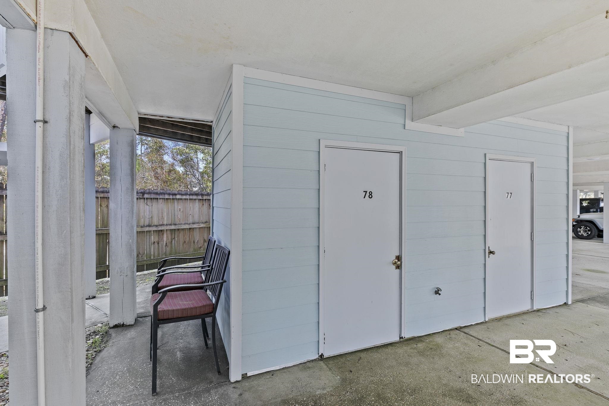 25861 Canal Road, Unit 78 Orange Beach, AL 36561 - Photo 44 of 45 View of outbuilding with fence