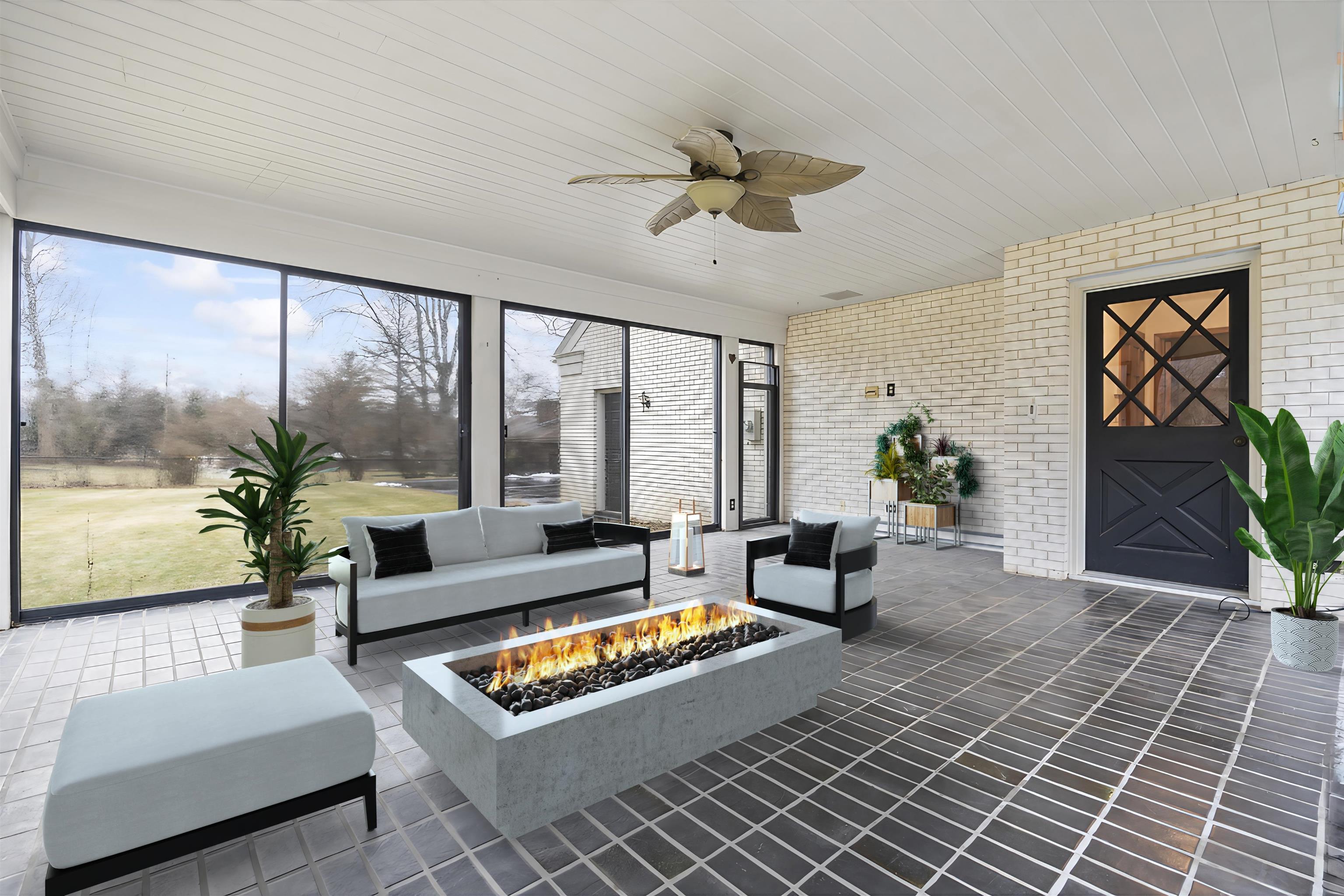 4215 Singleton Road Rockford, IL 61114 - Photo 42 of 45 a living room with furniture and a large window