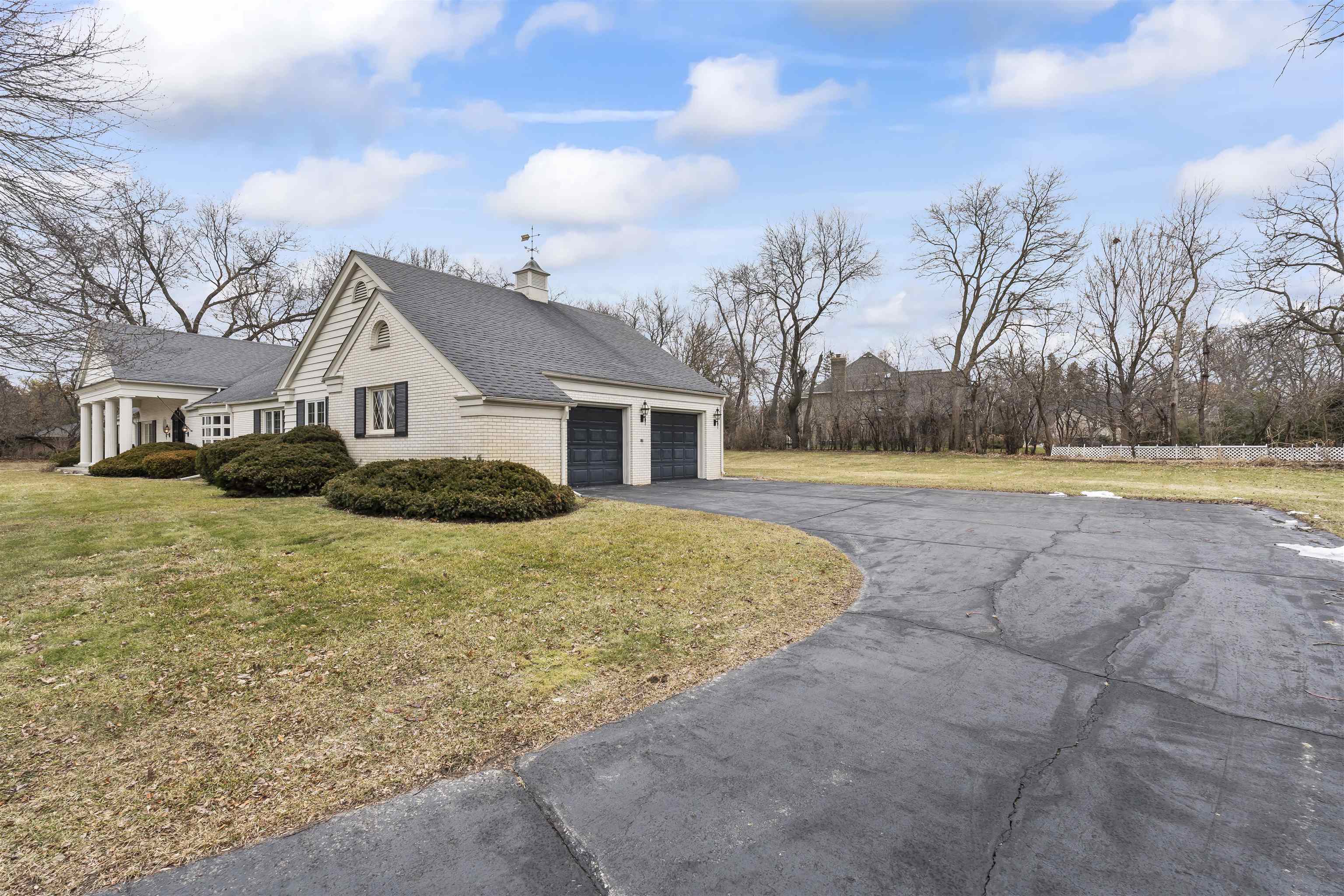 4215 Singleton Road Rockford, IL 61114 - Photo 8 of 45 a front view of house with yard and trees in the background