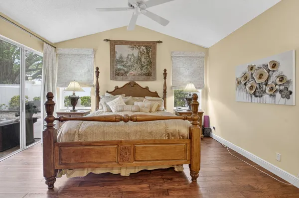 a bed sitting in a room next to a window