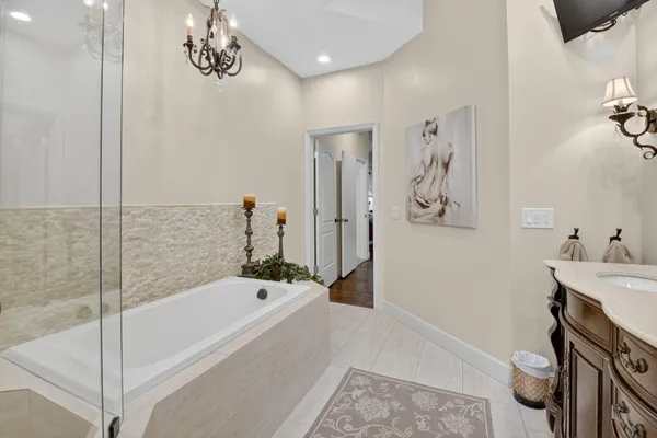 a bathroom with a bathtub and a shower