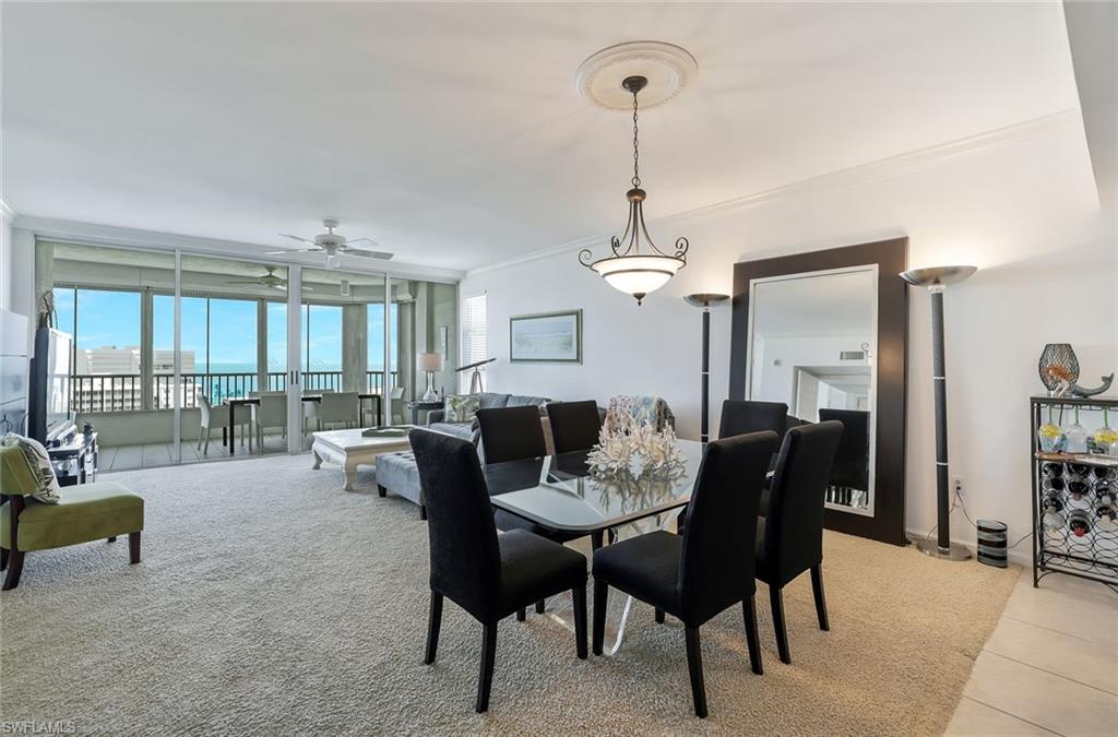 25 Bluebill Avenue, Unit 1103 Naples, FL 34108 - Photo 5 of 22 a view of a livingroom and dining room