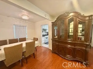 a living room with furniture a wooden floor and chandelier