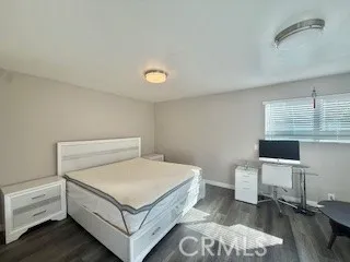 a bedroom with a bed and a desk