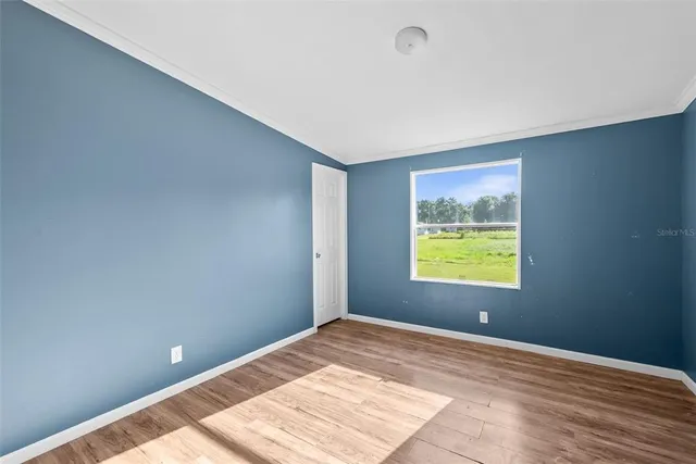 a view of an empty room and window