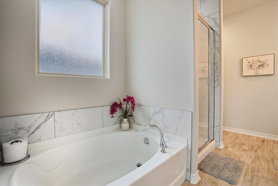 2685 Westeros Street Corpus Christi, TX 78415 - Photo 15 of 24 a white bath tub sitting next to a white sink and vanity