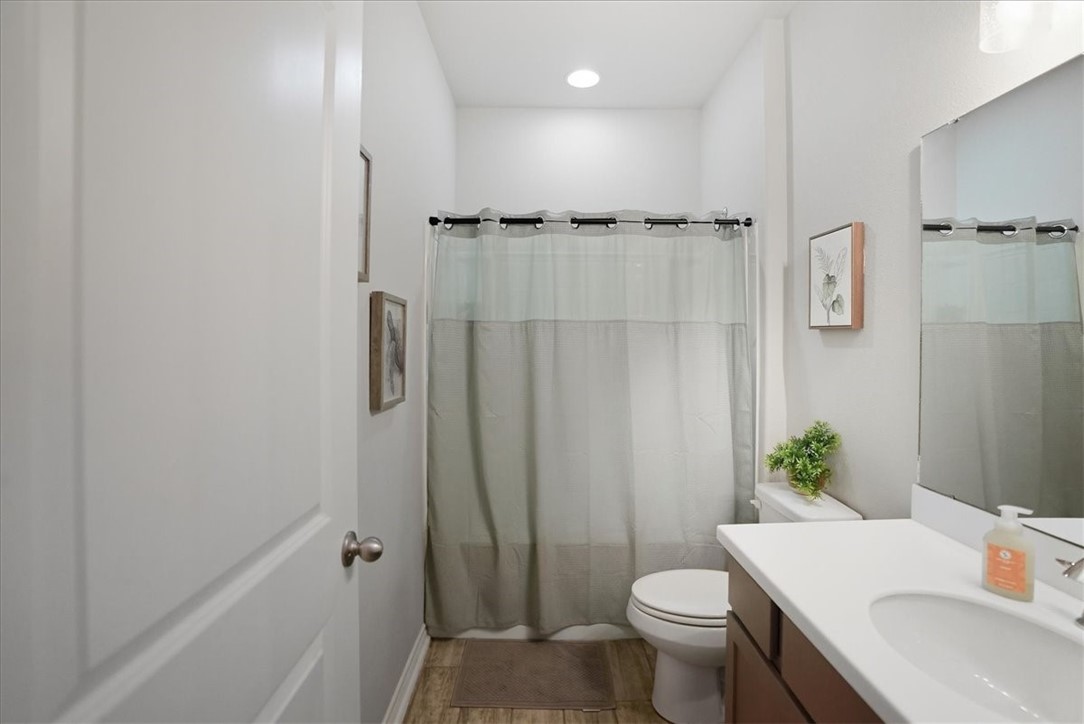 2685 Westeros Street Corpus Christi, TX 78415 - Photo 21 of 24 a bathroom with a sink toilet and shower