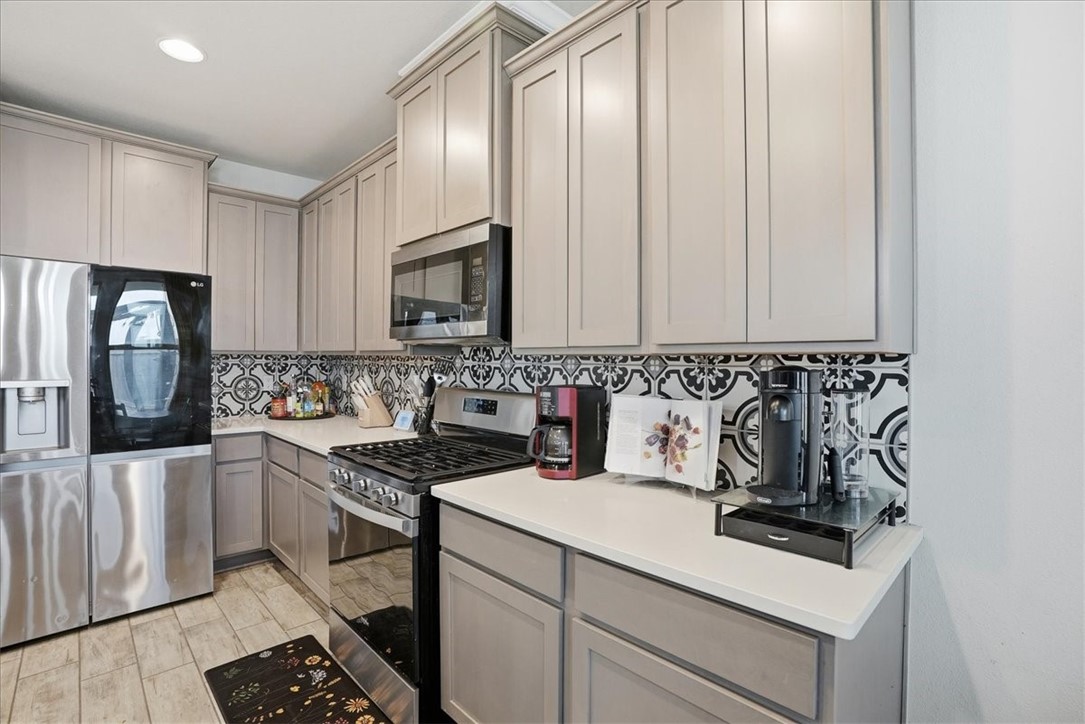 2685 Westeros Street Corpus Christi, TX 78415 - Photo 8 of 24 a kitchen with granite countertop a sink and a stove top oven