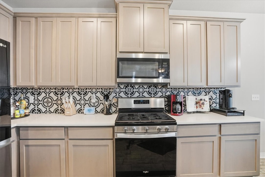 2685 Westeros Street Corpus Christi, TX 78415 - Photo 9 of 24 a kitchen with a sink stove and cabinets