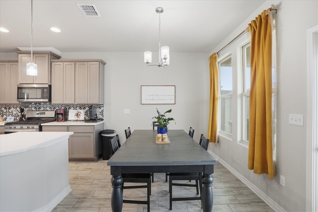 2685 Westeros Street Corpus Christi, TX 78415 - Photo 10 of 24 a kitchen with a table chairs sink and cabinets