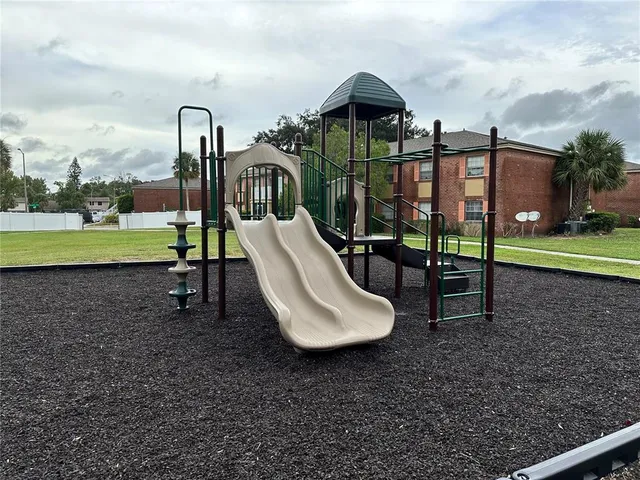 a front view of house with a garden