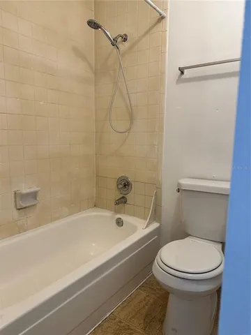a bathroom with a toilet and a bathtub
