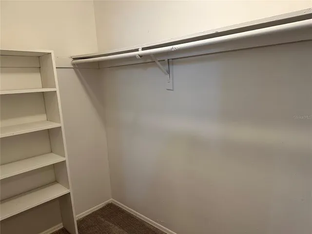 a view of an empty walk in closet