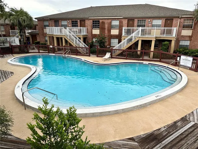 a view of a swimming pool with a lounge chairs