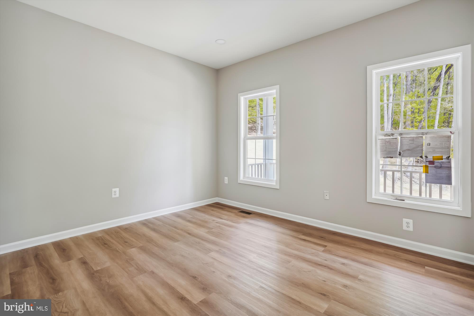 1 Riley Road Warrenton, VA 20187 - Photo 13 of 24 a view of an empty room with wooden floor and a window