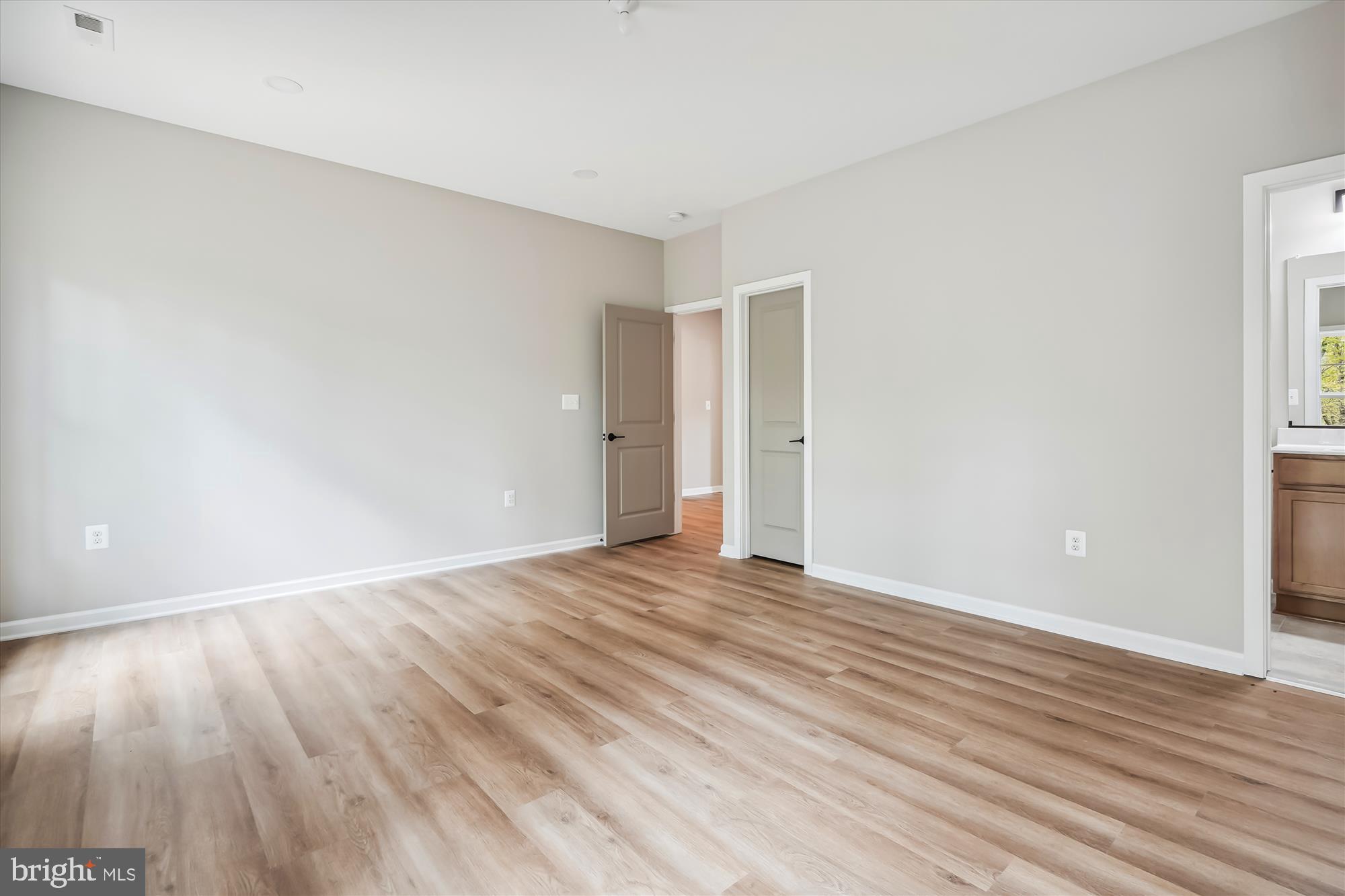 1 Riley Road Warrenton, VA 20187 - Photo 22 of 24 a view of an empty room with wooden floor and a window