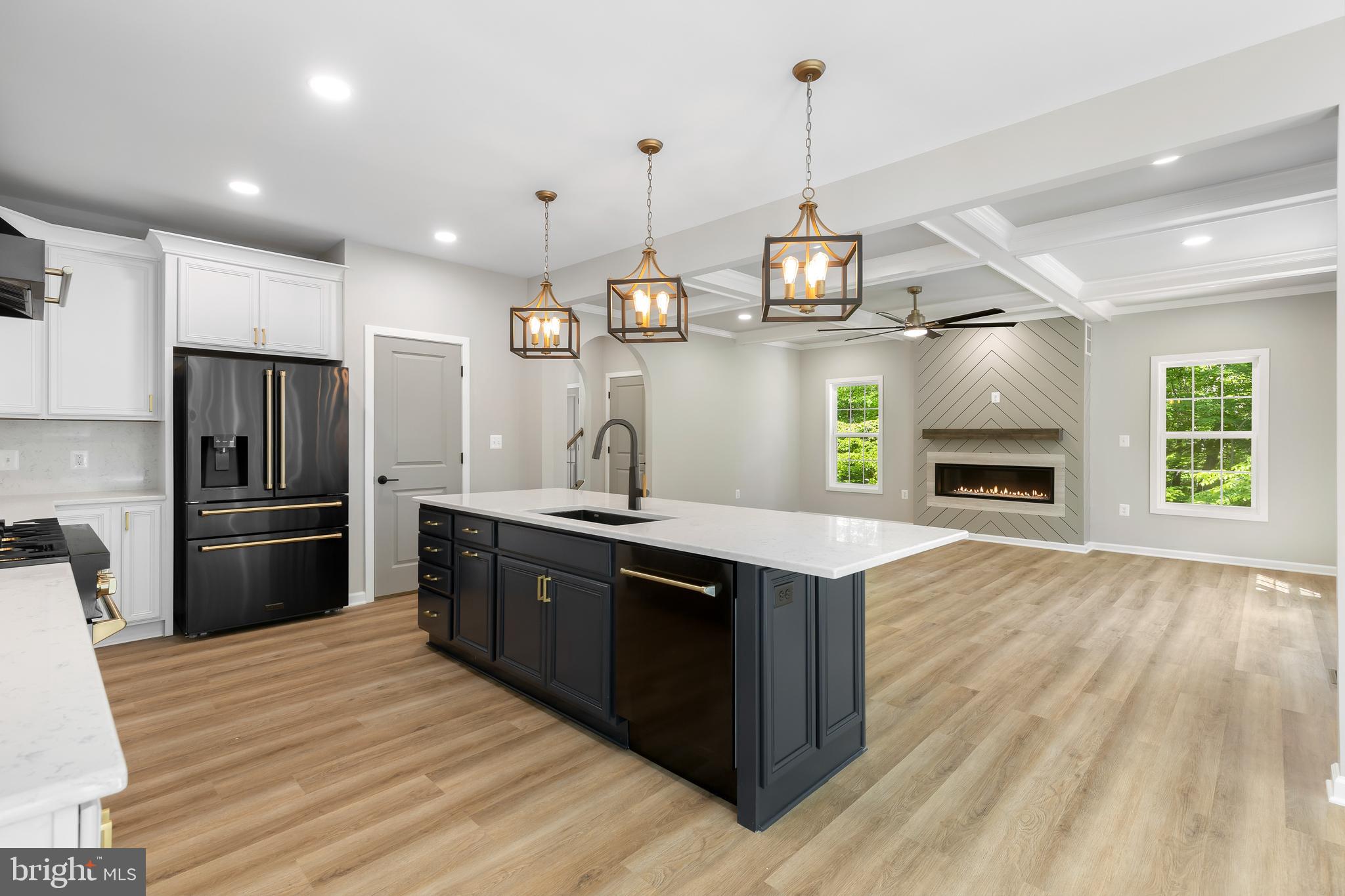 1 Riley Road Warrenton, VA 20187 - Photo 6 of 24 a kitchen with stainless steel appliances granite countertop a refrigerator a sink dishwasher a stove and a dining table with wooden floor