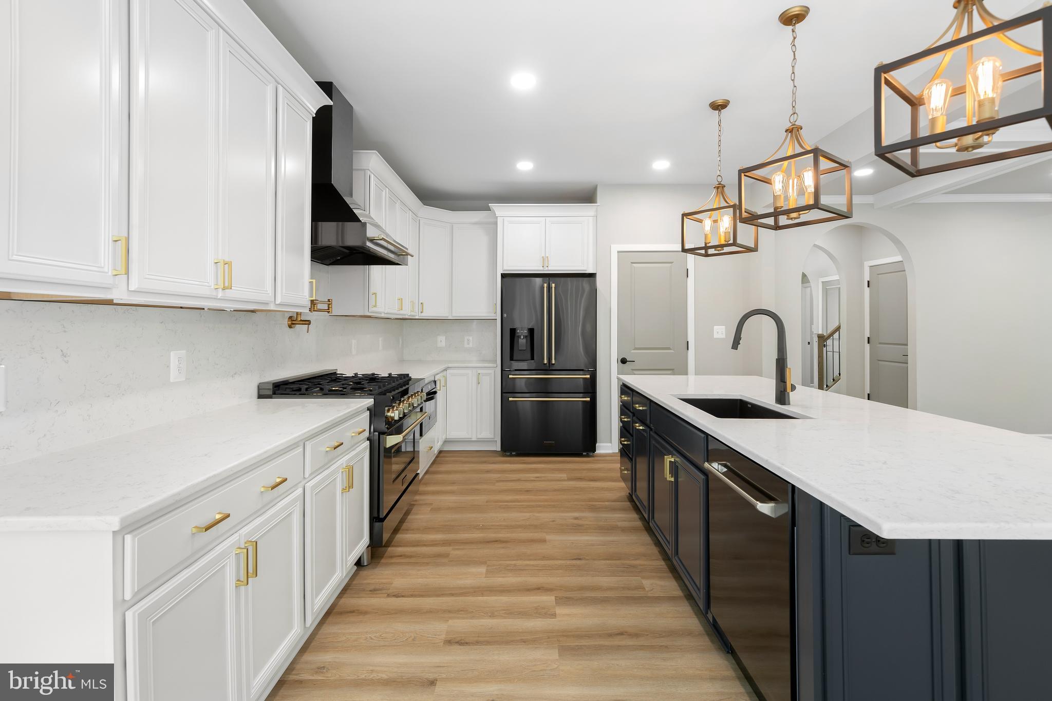 1 Riley Road Warrenton, VA 20187 - Photo 7 of 24 a large kitchen with stainless steel appliances granite countertop a sink a stove and a refrigerator