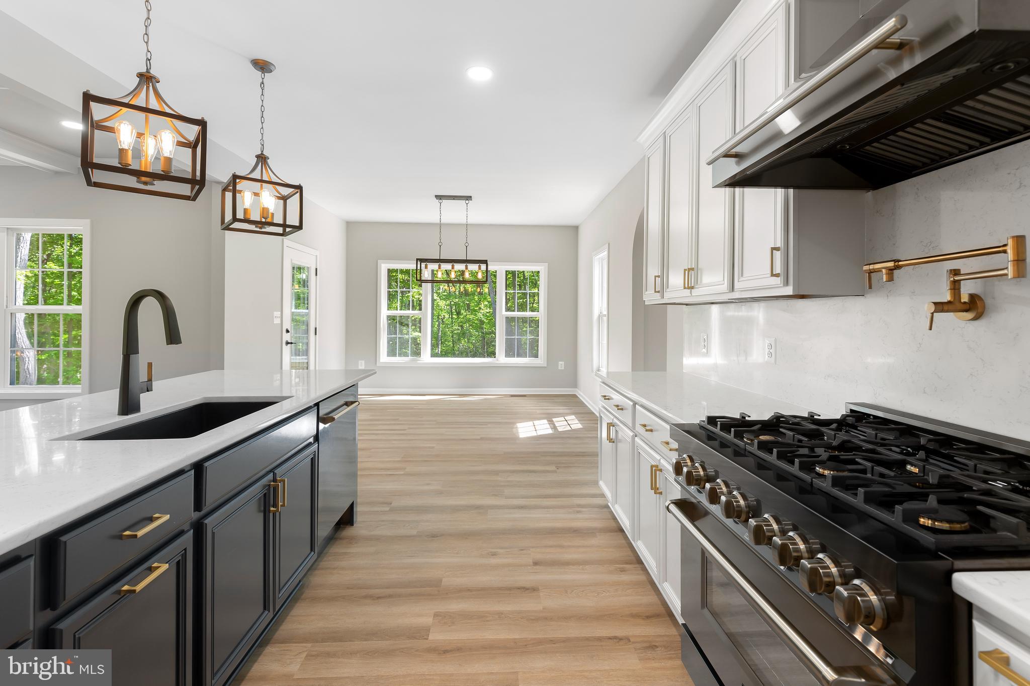 1 Riley Road Warrenton, VA 20187 - Photo 9 of 24 a kitchen with stainless steel appliances a sink stove and cabinets