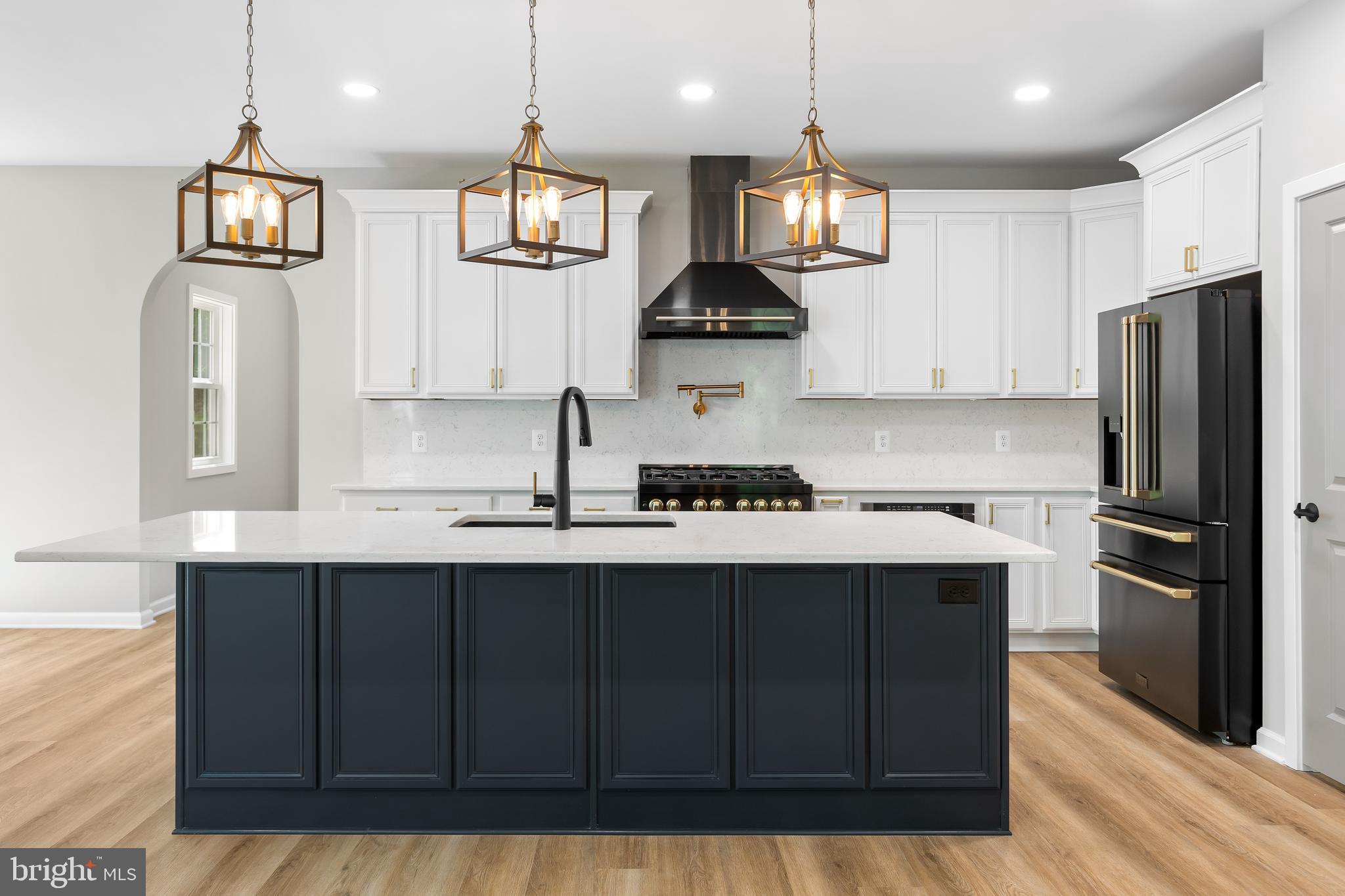 1 Riley Road Warrenton, VA 20187 - Photo 10 of 24 a kitchen with stainless steel appliances granite countertop a sink stove and refrigerator