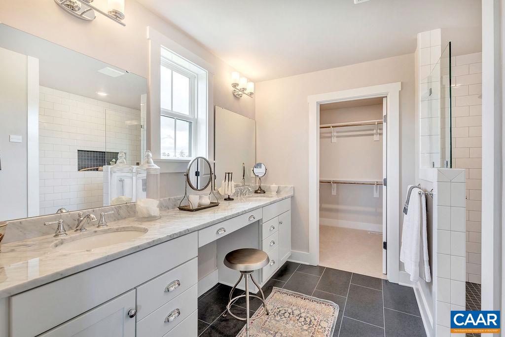 1445 Thompson Farm Road Charlottesville, VA 22901 - Photo 21 of 33 a spacious bathroom with a granite countertop sink a mirror and a shower