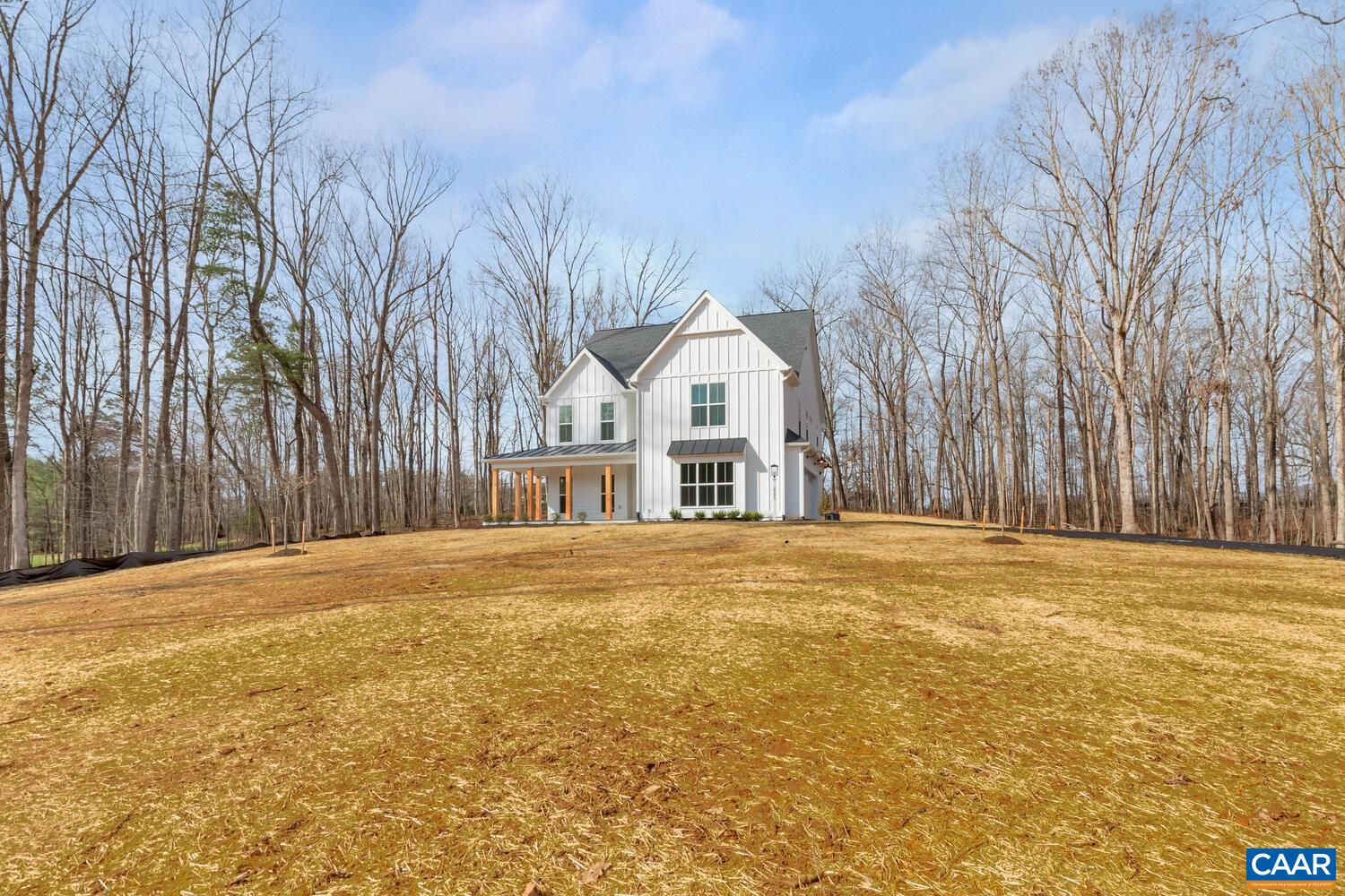 1445 Thompson Farm Road Charlottesville, VA 22901 - Photo 3 of 33 a front view of a house with a garden and trees