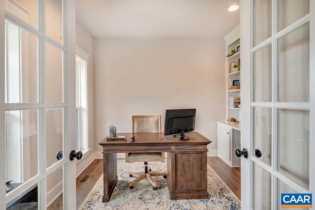 1445 Thompson Farm Road Charlottesville, VA 22901 - Photo 4 of 33 a view of a workspace with furniture and a window