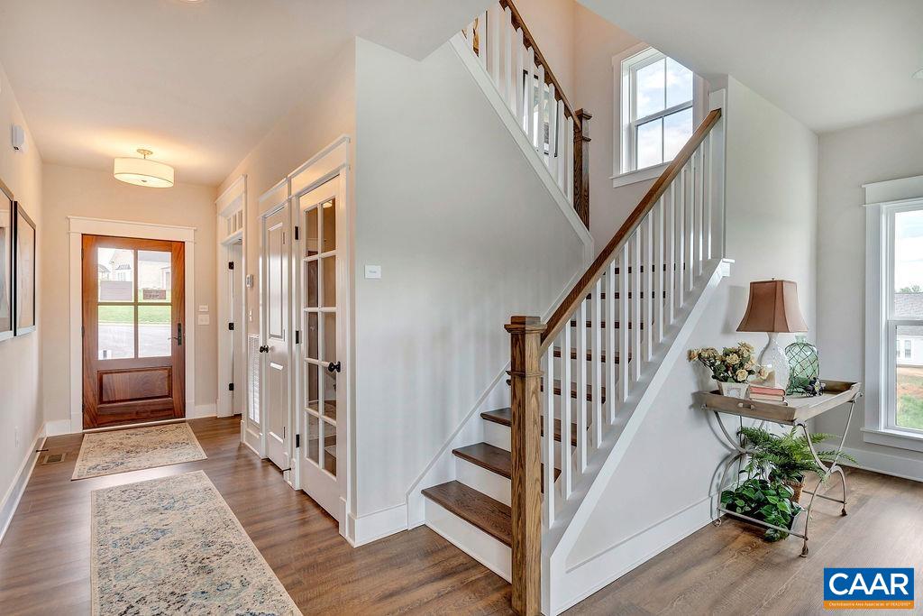 1445 Thompson Farm Road Charlottesville, VA 22901 - Photo 6 of 33 a view of an entryway with wooden floor and stairs