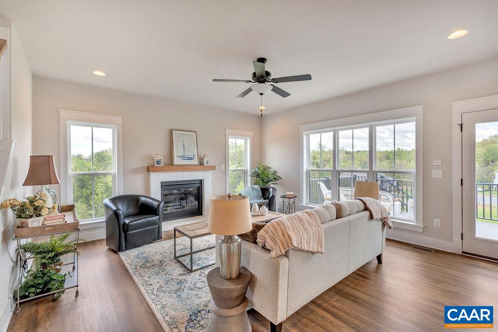 1445 Thompson Farm Road Charlottesville, VA 22901 - Photo 7 of 33 a living room with furniture fireplace and a large window