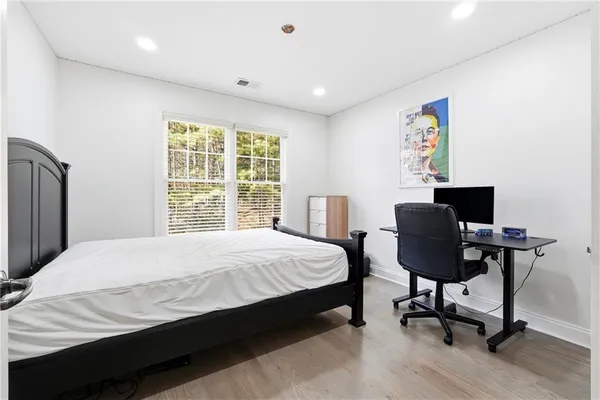 a bedroom with a bed and window