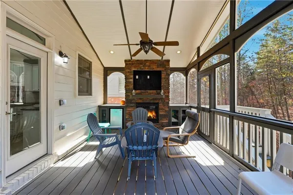 a living room with furniture tv and a large window