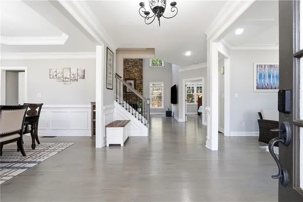 a view of dining room with furniture and wooden floor