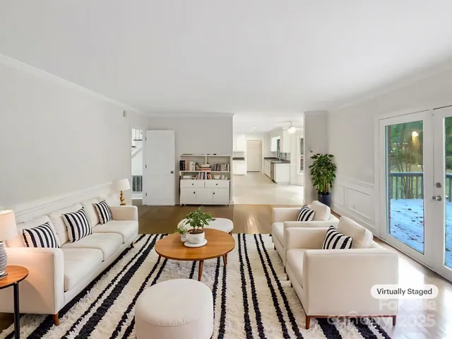 a living room with furniture and a table